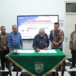 Bupati Asahan Tandatangani NPHD Pendanaan Pemilu Kepala Daerah 2024